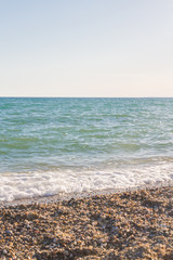 The sea shore at summer Sunny day just before sunset