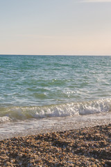 The sea shore at summer Sunny day just before sunset