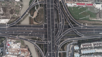 Aerial view of highway and overpass in city on a cloudy day