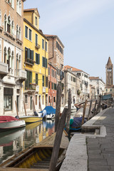 Fototapeta na wymiar Rio San Barnaba, Dorsoduro, Venice, Veneto, Italy with reflections in the canal 