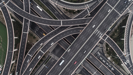 Aerial view of highway and overpass in city on a cloudy day