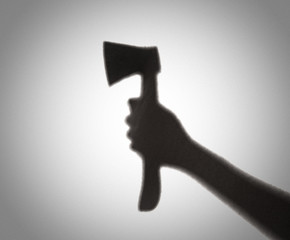 Silhouette of someone holding axe,blur image