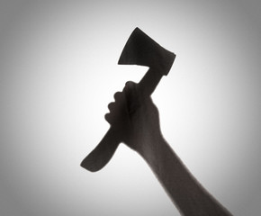 Silhouette of someone holding axe,blur image