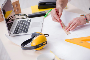 Architect working in his studio on new project