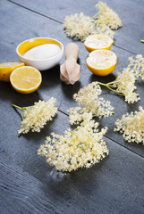 elder flower juice ingredients on  black wood table background