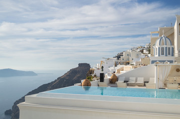 Whitewashed Houses on Cliffs with Sea View and Pool in Fira, Santorini, Cyclades, Greece