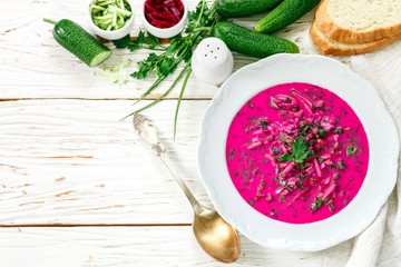 Cold fresh traditional vegetable summer soup made of beetroot (beet), cucumber, dill, parsley,...