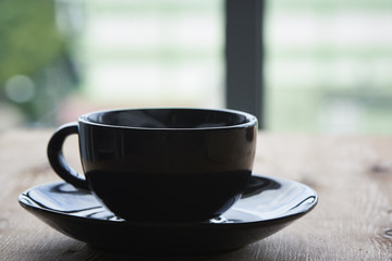 A cup of hot coffee on the table
