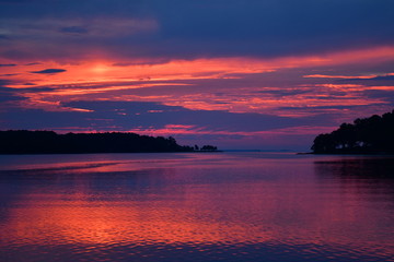 Deep blue, purple, and orange sunrise over the Potomac River in Virginia