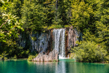Fototapeta na wymiar akes with blue water and waterfall.