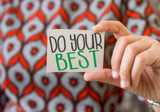 woman holdig small paper with do your best