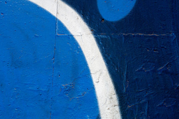 Texture of a colored wall, graffiti blue and white, strip. Place for text