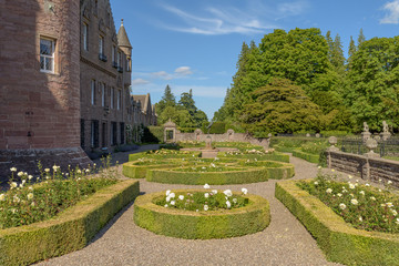 Obraz premium Gardens at Glamis Castle in Scotland. Glamis Castle is situated close to the village of Glamis in Angus. It is the home of the Earl and Countess of Strathmore and Kinghorne, and is open to the public.