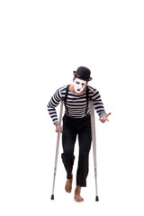 Mime with crutches isolated on white background