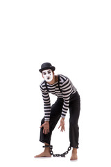 Mime with his feet chained isolated on white
