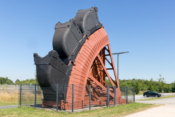 Exposition of bucket wheel at original size from digging excavator in open pit coal mines in Germany