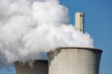Cooling towers and smokestackss coal fired power plant near lignite mine Garzweiler in Germany