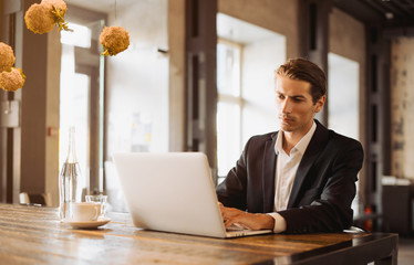 Young man drawing template for the web site associated with digital marketing, current trends and...