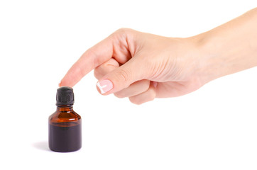 Bottle of medicine Iodine in the hand on a white background isolation