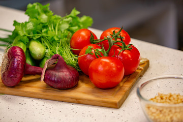 Image of a variety of colorful vegetables on a cutting wooden board