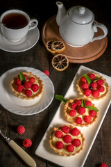 Obraz na płótnie Canvas Cakes with raspberries on the table