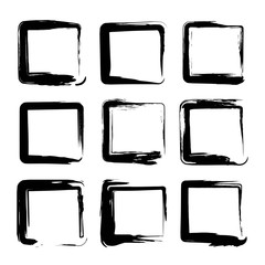 Square smears of black textured brush strokes isolated on a white background