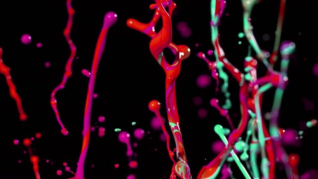Colorful splashing paint in super slow motion. Shot with high speed cinema camera, 1000fps