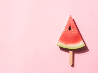 watermelon popsicle on pink,flat lay