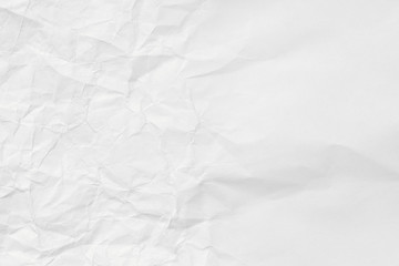 The texture of white paper with dents and kinks. Background of the rumpled surface.