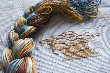 Part of cross-stitch picture close up