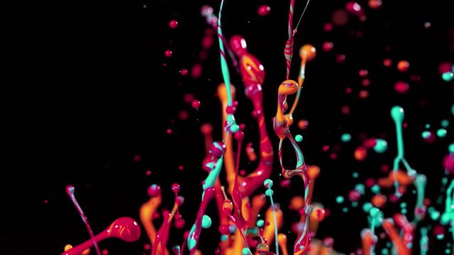 Colorful splashing paint in super slow motion. Shot with high speed cinema camera, 1000fps