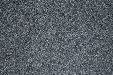 A wall covered with a stone crumb in gray color