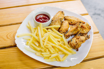 Fried chicken with french fries on the table