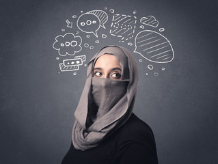 Young muslim woman wearing niqab with drawn speech bubbles above her head 