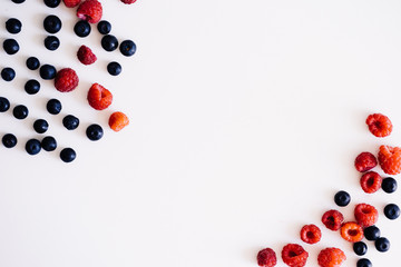raspberry and blueberry frame on a white background