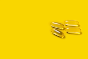 pills on yellow background. yellow cure pills. medicaments