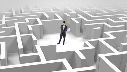 Young businessman standing in a middle of a 3D maze

