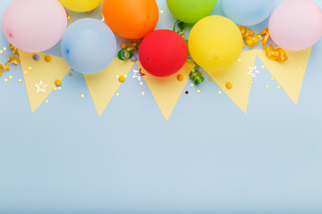 Birthday party background border with baloons and confetti, on blue surface with copy space