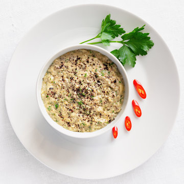 aubergine dip made with tahina, lemon juice, garlic, and fresh herbs sprinkled with sumac
