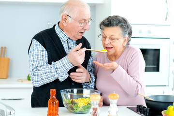 senior couple in the kitchen cooking together
