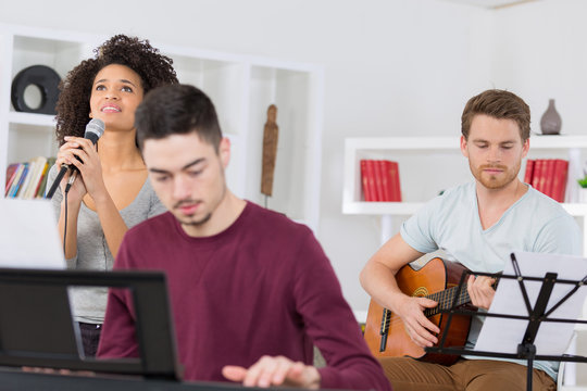 home band learning new song together
