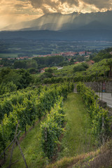 Sun filtering through the clouds over the Canavese Mountains in Piedmont Italy