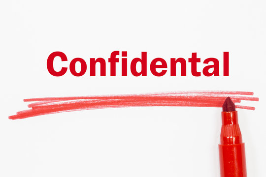 confidental word written with red marker