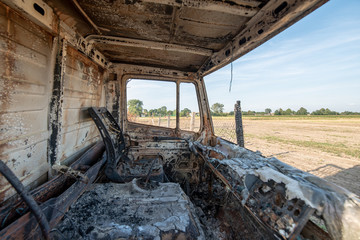 Old burned destroyed car