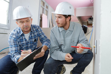 two builders indoors