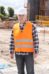Fototapeta na wymiar elderly construction site worker