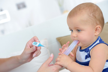 measuring temperature to a baby