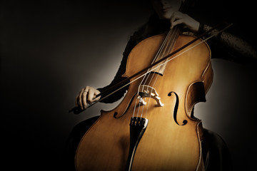 Cello player. Cellist hands playing cello closeup