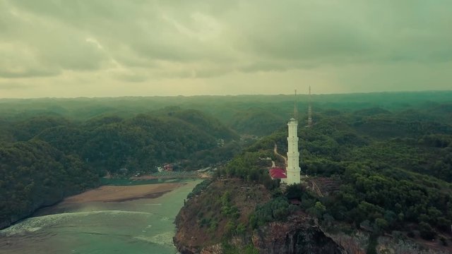 Lighthouse aerial view constructed over the hill located in Baron beach, Yogyakarta, Indonesia