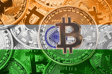 Stack of Bitcoin India flag. Bitcoin cryptocurrencies concept. BTC background.